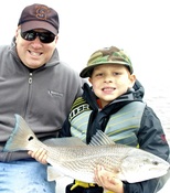 RJ my youngest angler to catch a redfish on fly sight fishing Beaufort 