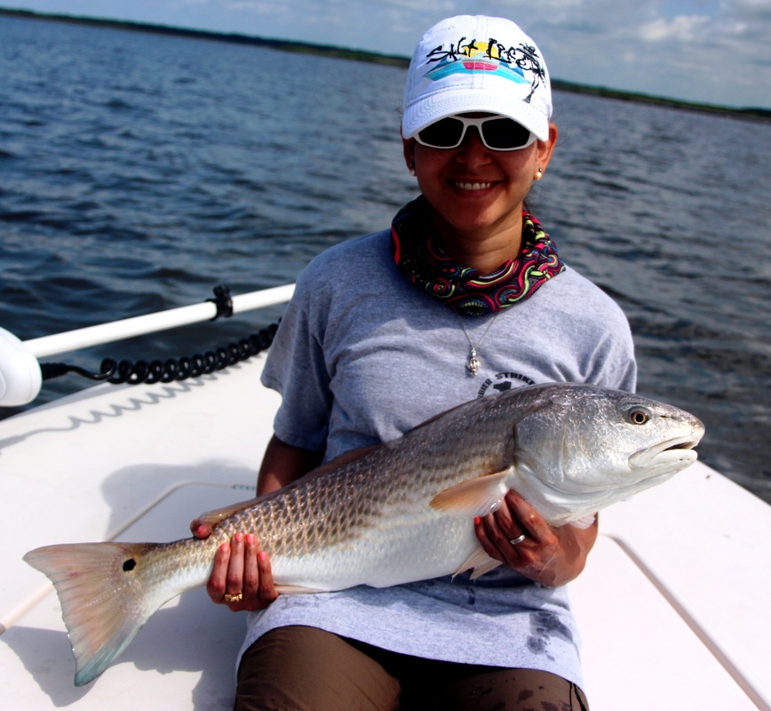 Rae with a nice redfish she sight fished in Hilton Head Island with Capt. Mark Nutting of Locoflycharters.com